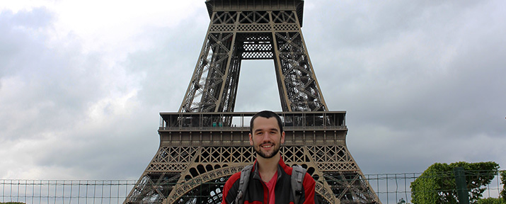 Student standing in front of Eiffel Tower