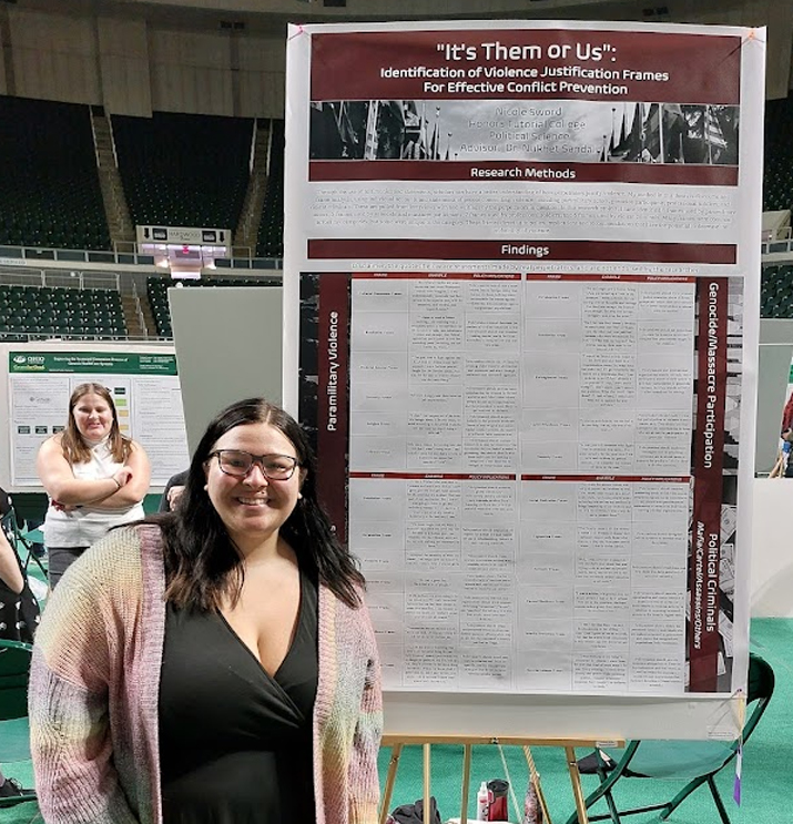 Nicole Sword with her Expo poster "It's Them or Us"
