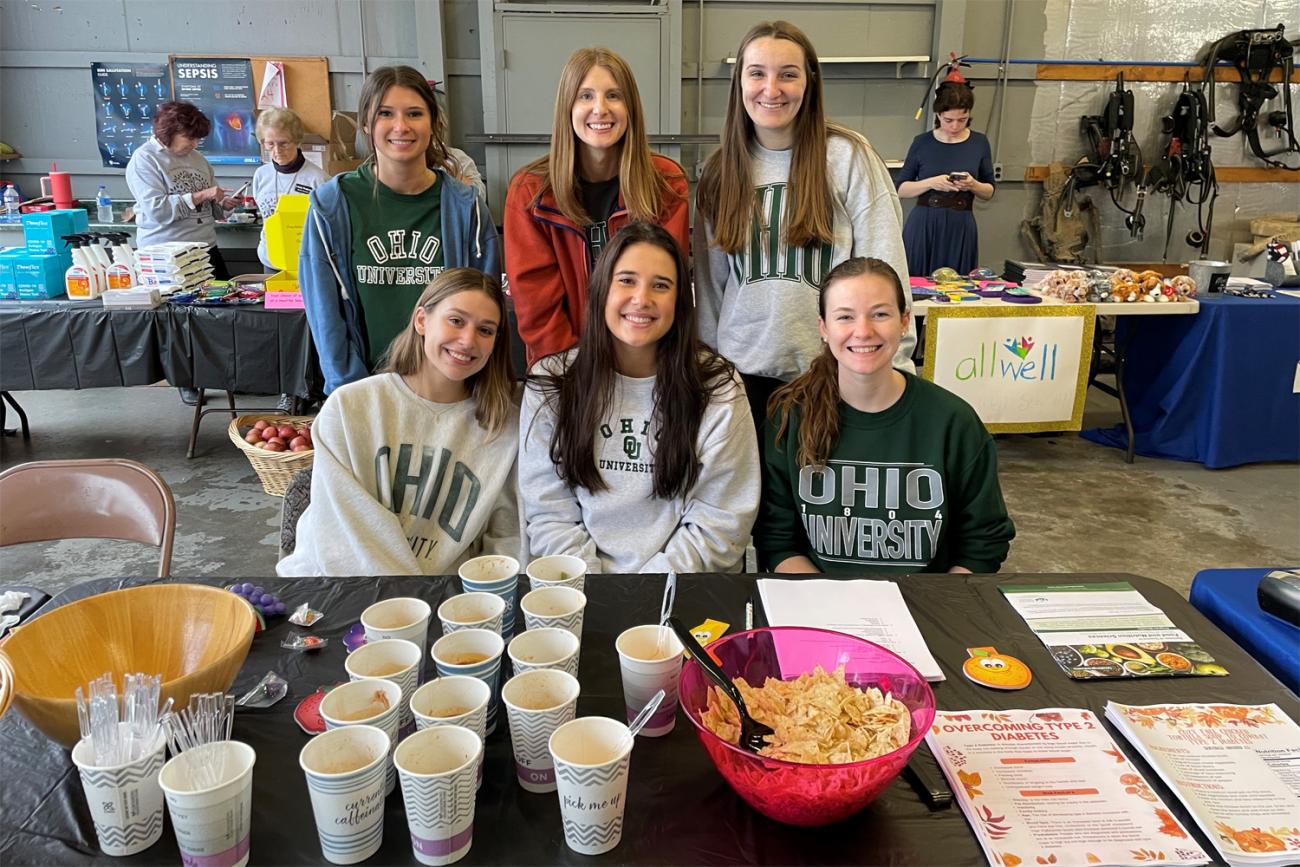 Ohio University nutrition science students with food display.