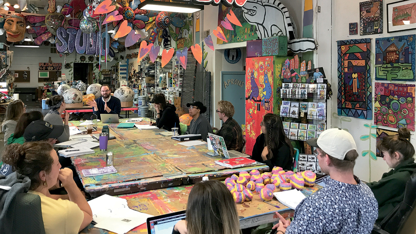 Sam Dodd leads a discussion with students in his 30 Mile Studio course at Passion Works Studio in Athens in fall 2018.