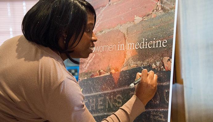 Woman signing poster