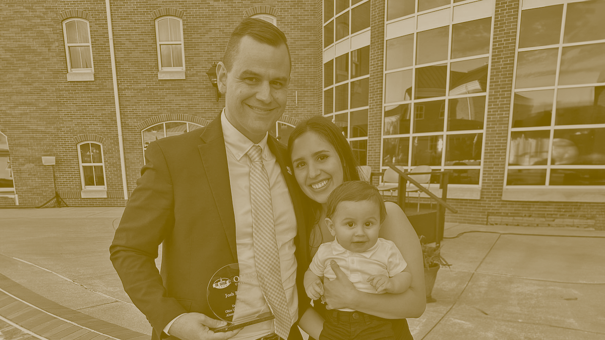 Leadership Award winner Josh Blanton with his wife and child