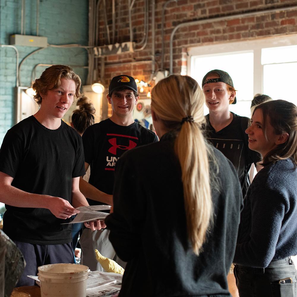 Students talk in a group