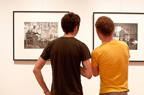 People looking at paintings