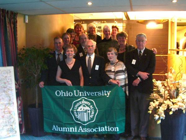 People holding a banner that reads, "Ohio University Alumni Association"