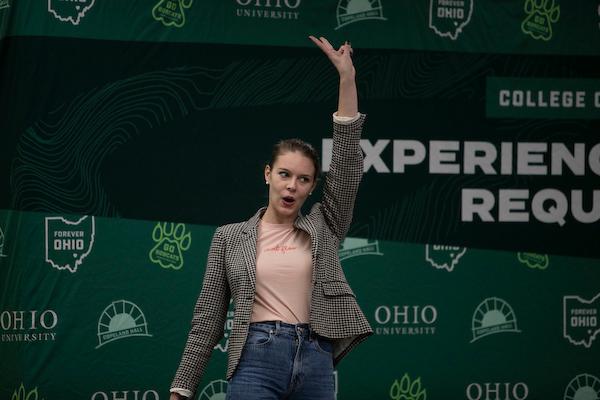 Claire Coder raising hand during speech