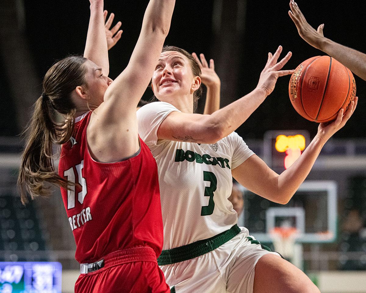 Ohio guard Madi Mace takes the ball to the hoop against a Miami defender