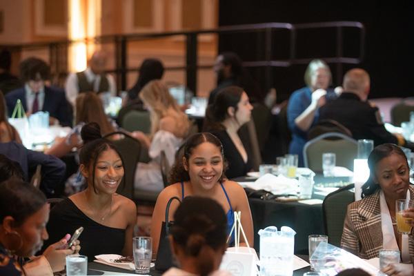 Students laugh during an awards ceremony