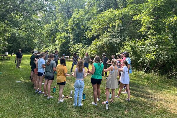 Students do team-building activities outdoors