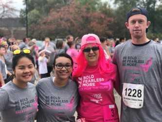 5k runners one wearing bright pink