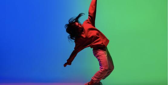 Person dancing hip hop with bright background