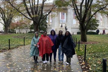 Trinh Nguyen, Kymiya Byars, Lisa Flowers-Clements, Christine Blay, and Aryn Monroe are shown at Arlington National Cemetery