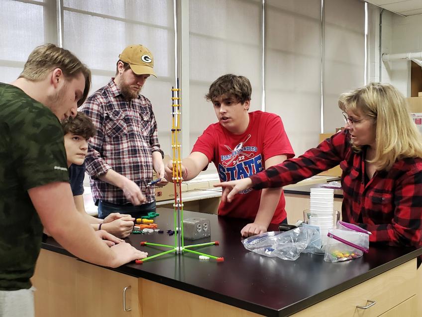 Students and their teacher in the classroom