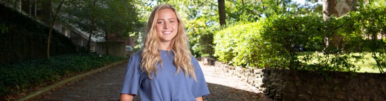 A sunny, outdoor portrait of Maddie McNamara on College Green