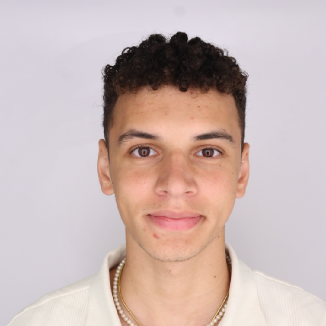 Headshot of Global Ambassador Tyrone Oppon against a white background.