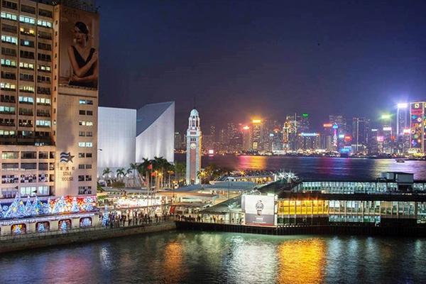 Asian city alight with night sky.