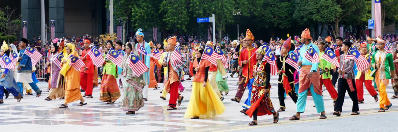 Malaysian youth parade, with students in colorful clothing