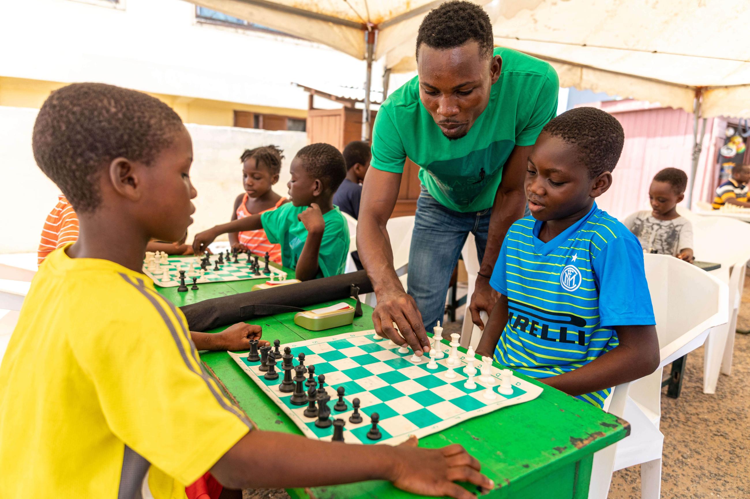 Children from the Chorkor region of Ghana play chess