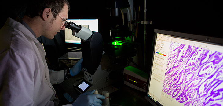Grad Carlson conducting cellular  biomedical research