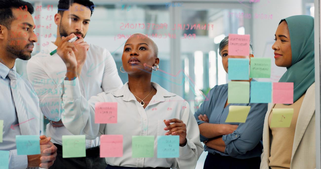 Woman leading project team in planning meeting