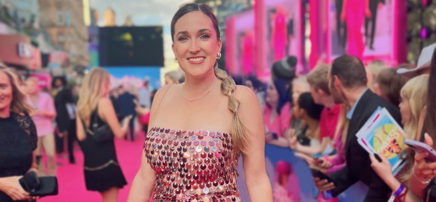 Kayla Carpenter at a Barbie movie premiere on the pink carpet.