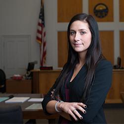woman standing in a courtroom 