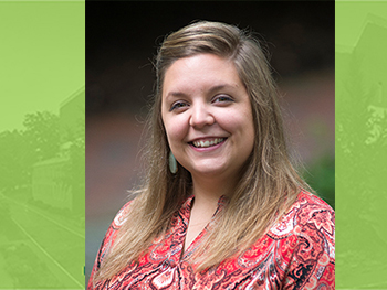 Portrait of Hanna Schmillen, incoming Assistant Dean for Research & Education Services, in front of a green background