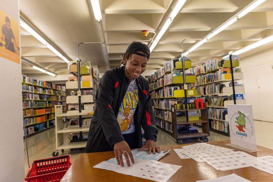 Picture of a student doing the scavenger hunt at Camp Alden