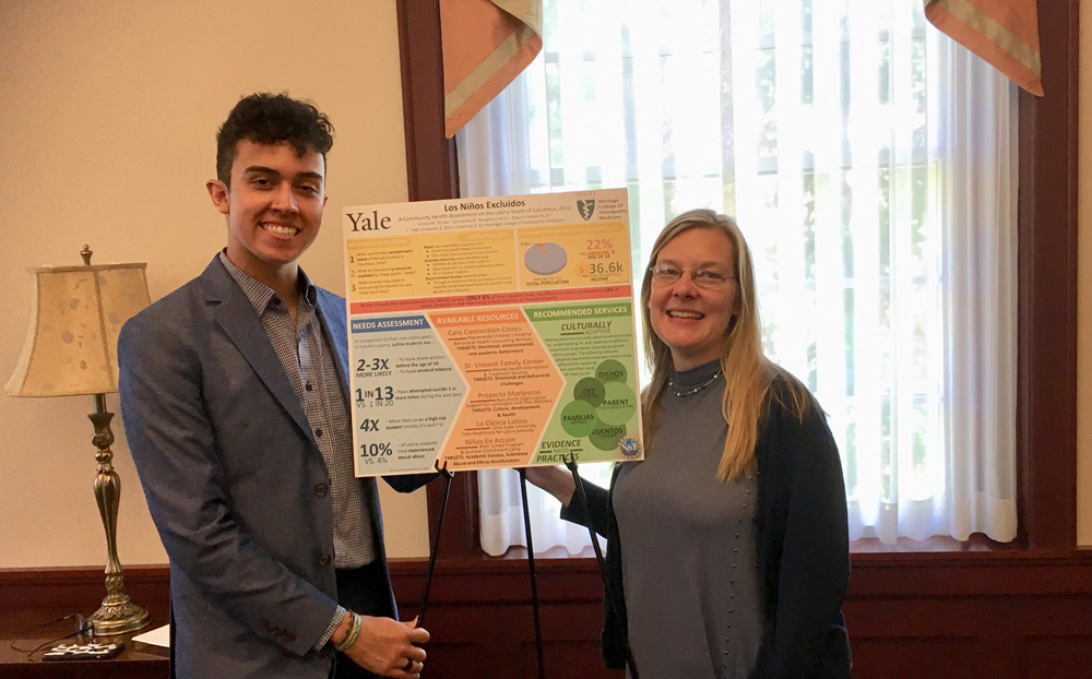 Victor Torres, left, presented his findings at the on campus research poster presentation on the last day of the program. Hist mentor was Dr. Dawn Graham.