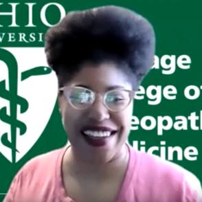 Tanisha King sits in front of a green screen with the words 'Ohio University Heritage College of Osteopathic Medicine' behind her.