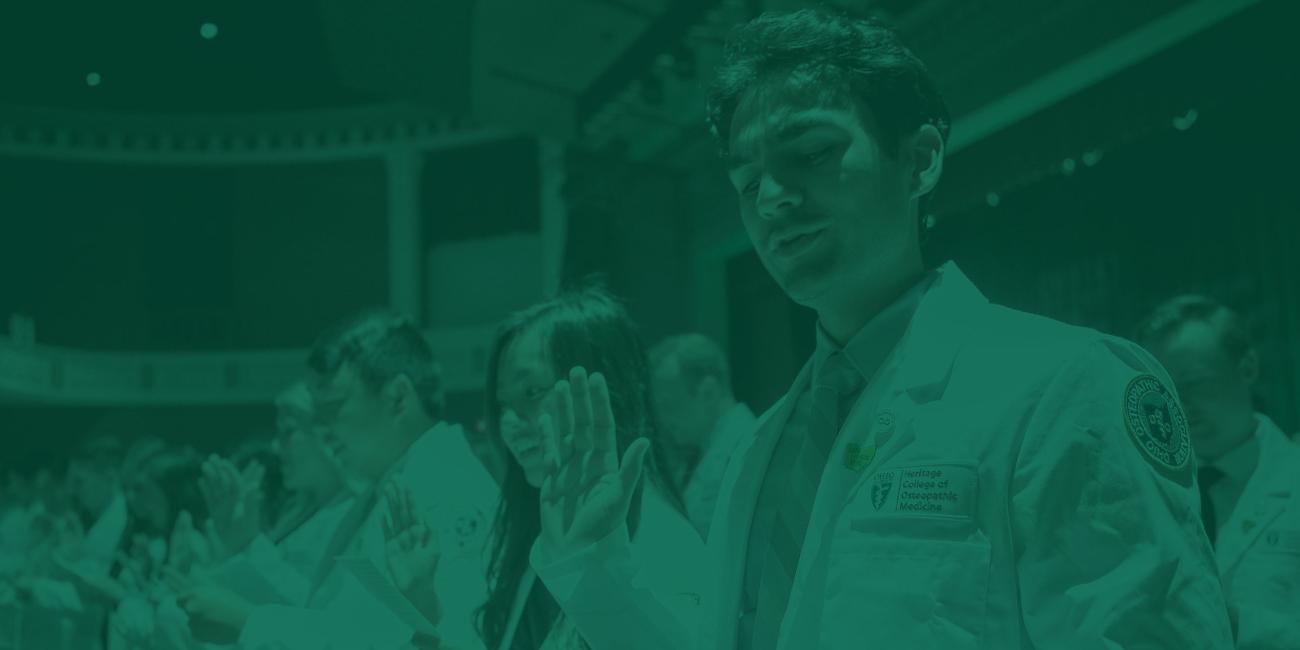 Medical students recite the Hippocratic Oath during their White Coat ceremony