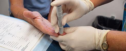 Person giving blood for screening