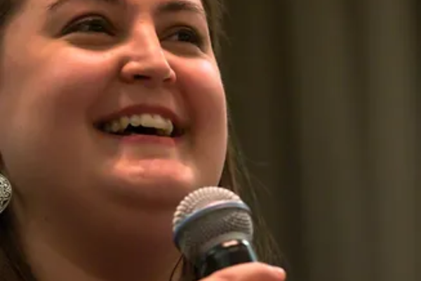 Woman speaking into microphone