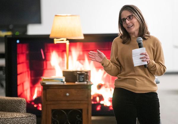 woman speaking into microphone