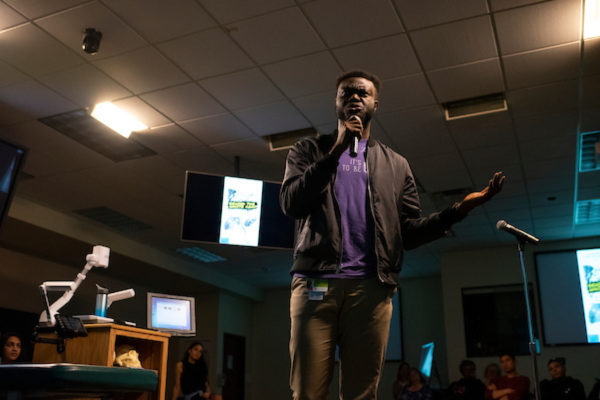 Man speaking into microphone