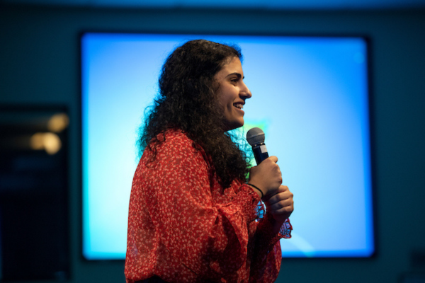 Woman speaking into microphone