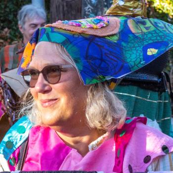 Hylie Voss walking with Passion Works in a parade