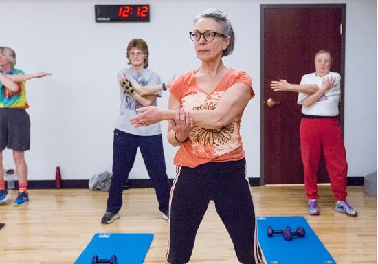 Participant standing doing yoga