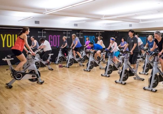 instructor leading a spin class