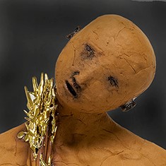 Ceramic sculpture of crooked human head