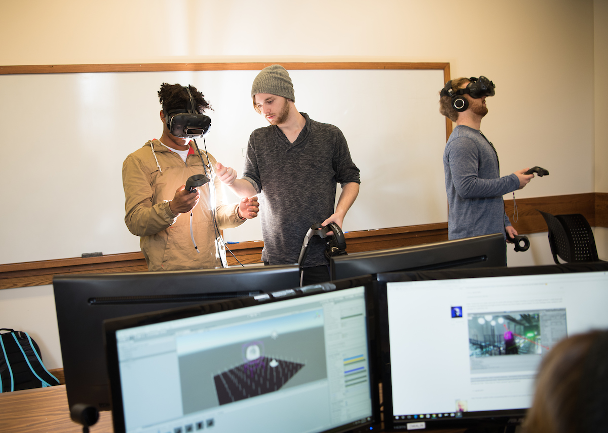 Students work with a Virtual Reality headset