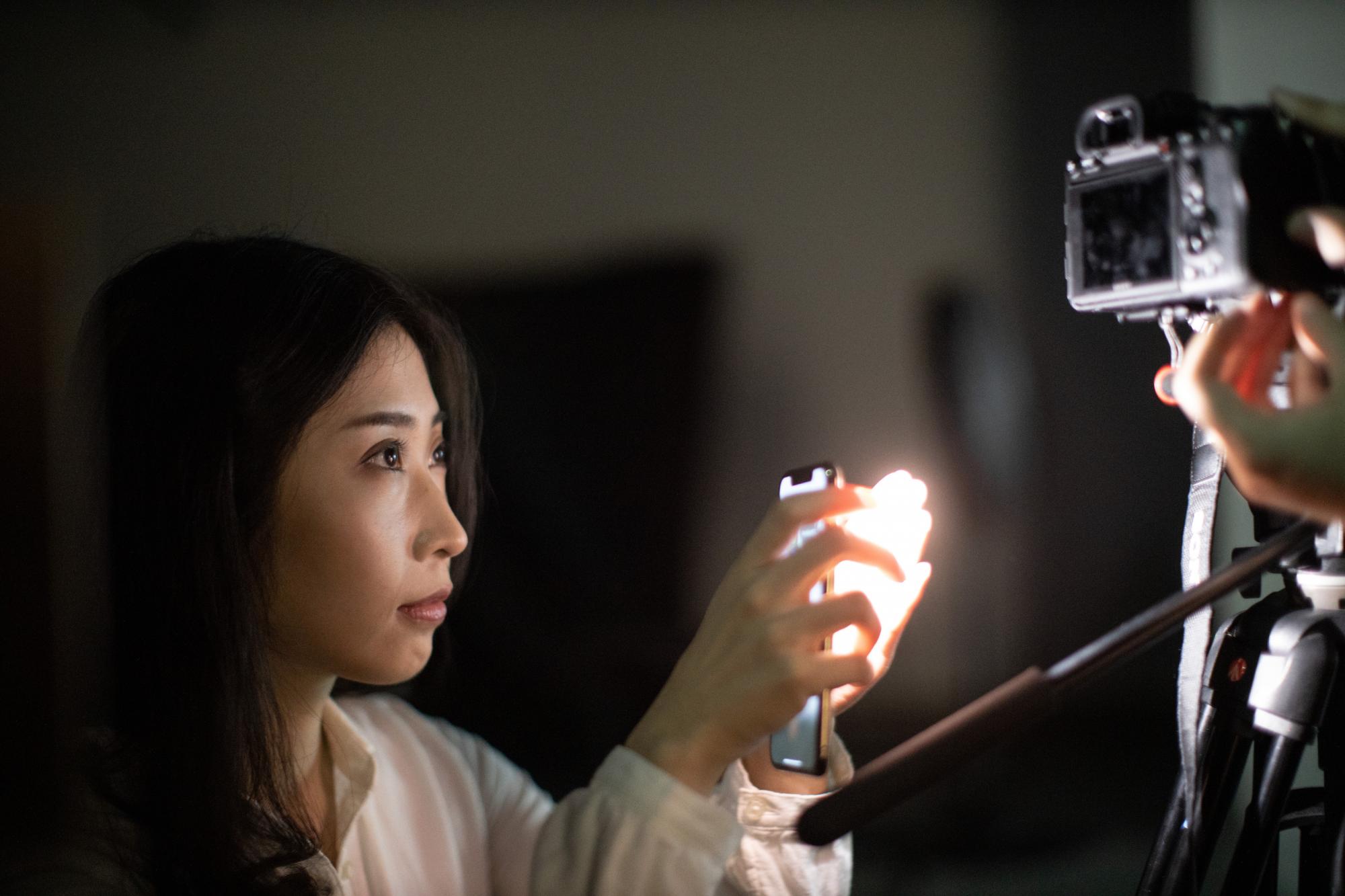 Photographer tests light for a photograph