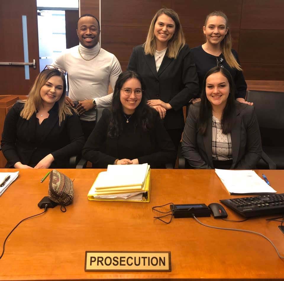 Members of the OHIO prosecution team pose for a group photo