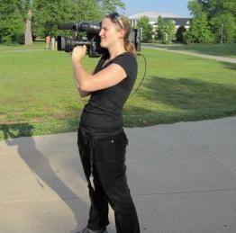 Andie holding a camera