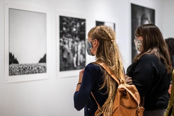 People in gallery looking at artwork