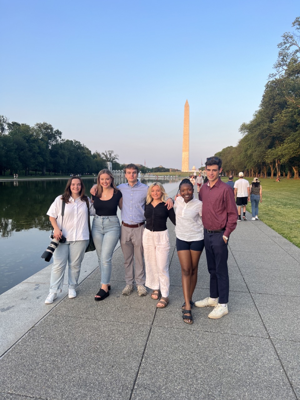 A group of students from the 2023 Summer Scripps in DC cohort poses in front of the Washington Monument.