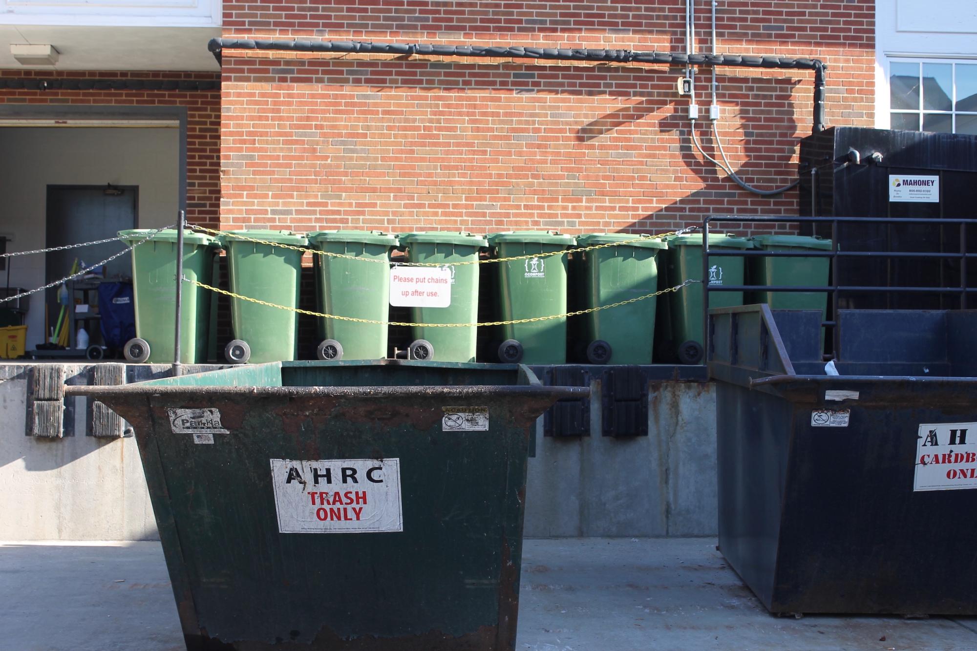 recycling bins on the side of nelson dining hall near garage entrance