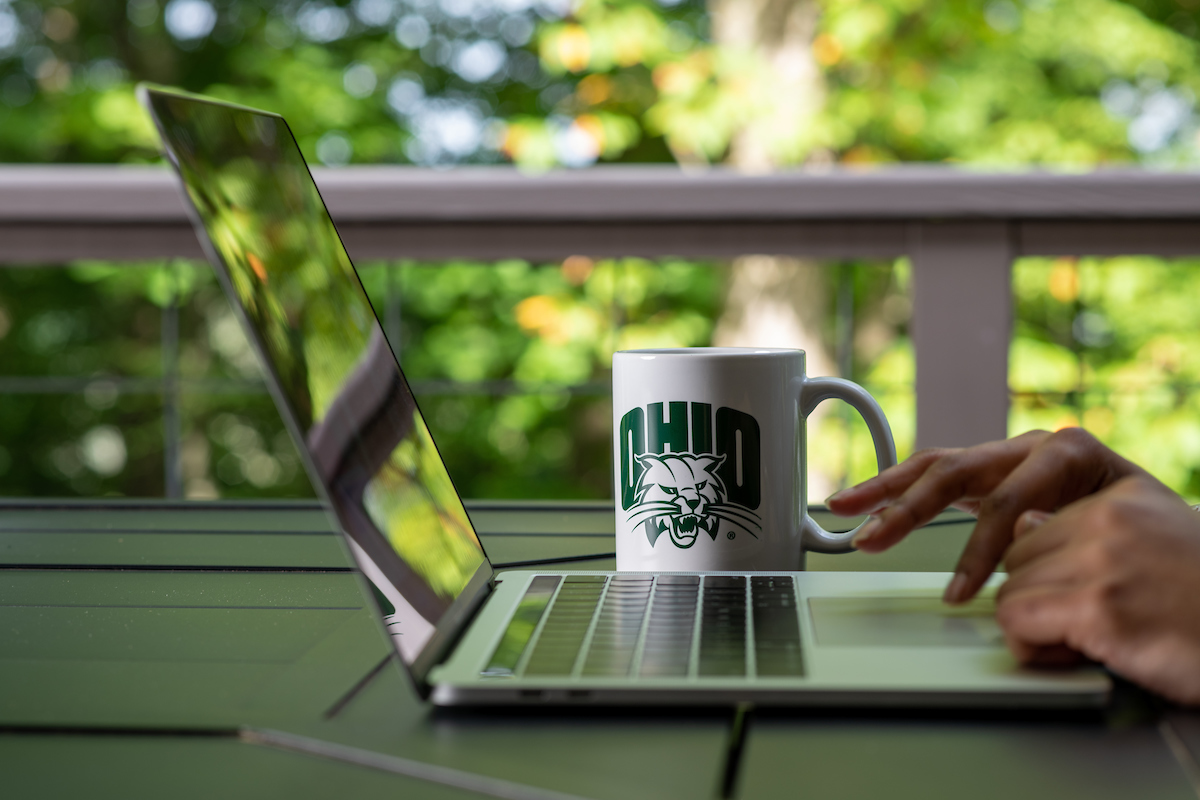 laptop with OHIO coffee mug