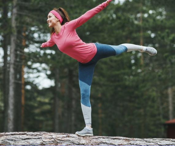 Person balancing on a log