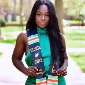 Terra Blakey wears a silk green halter top with a graduation cloth